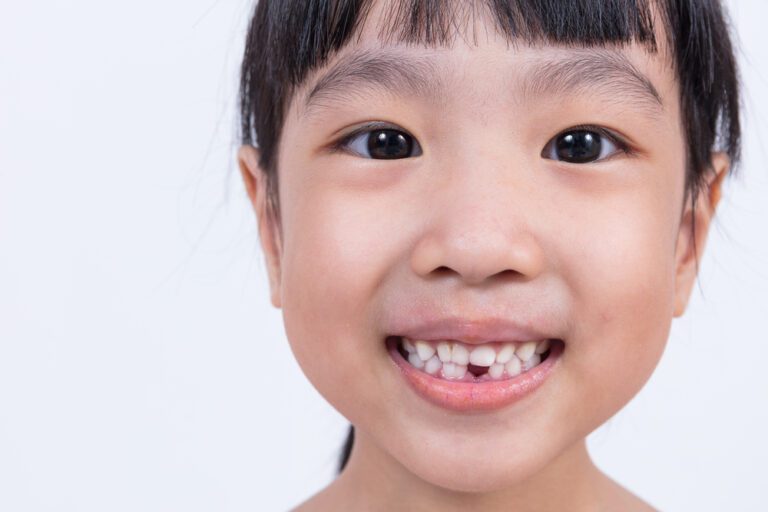 Happy Asian Chinese little girl with toothless smile